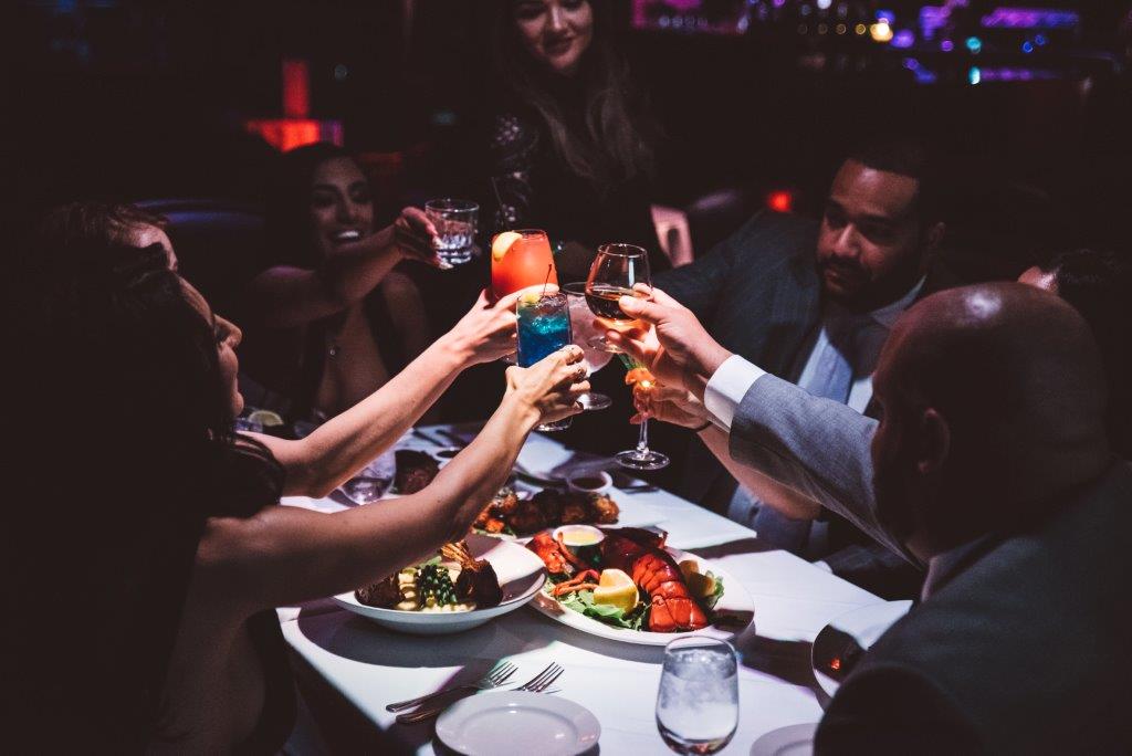 Group of professionals in nyc celebrating with a toast 